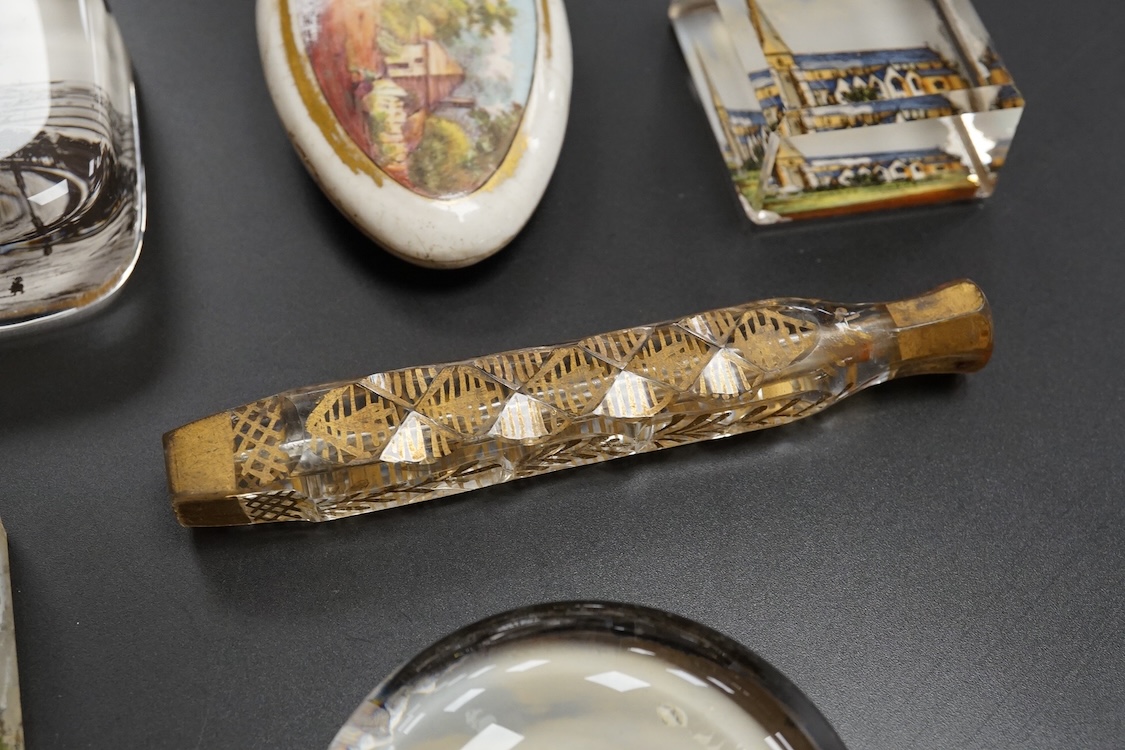 Six pictorial glass gem paperweights and three 19th century scent bottles, largest 11cm in length